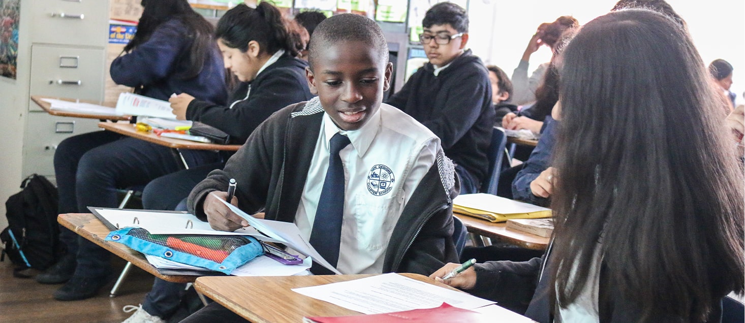 students sitting at desks working together