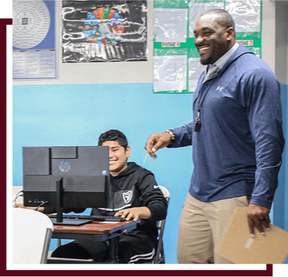 teacher smiling while giving instruction