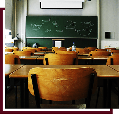 empty classroom with desks and chalkboard